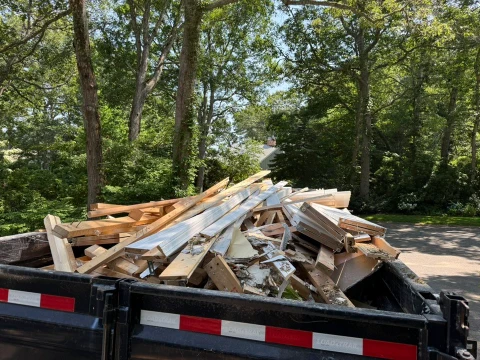 Construction Debris Removal Lubbock load of wood scraps and mixed lumber piled for haul-off