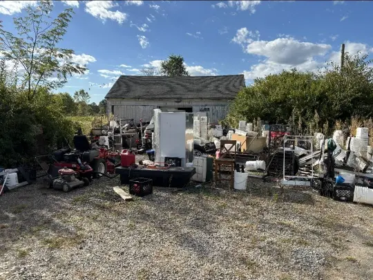 Pile of old appliances and scrap items set out for appliance disposal and recycling in Lubbock