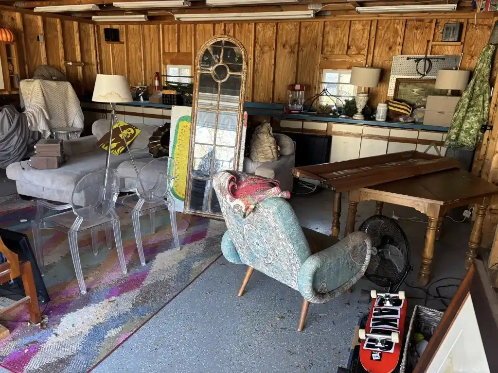 Estate Cleanout Services in Lubbock, Tx garage packed with furniture, tables, chairs, and household items