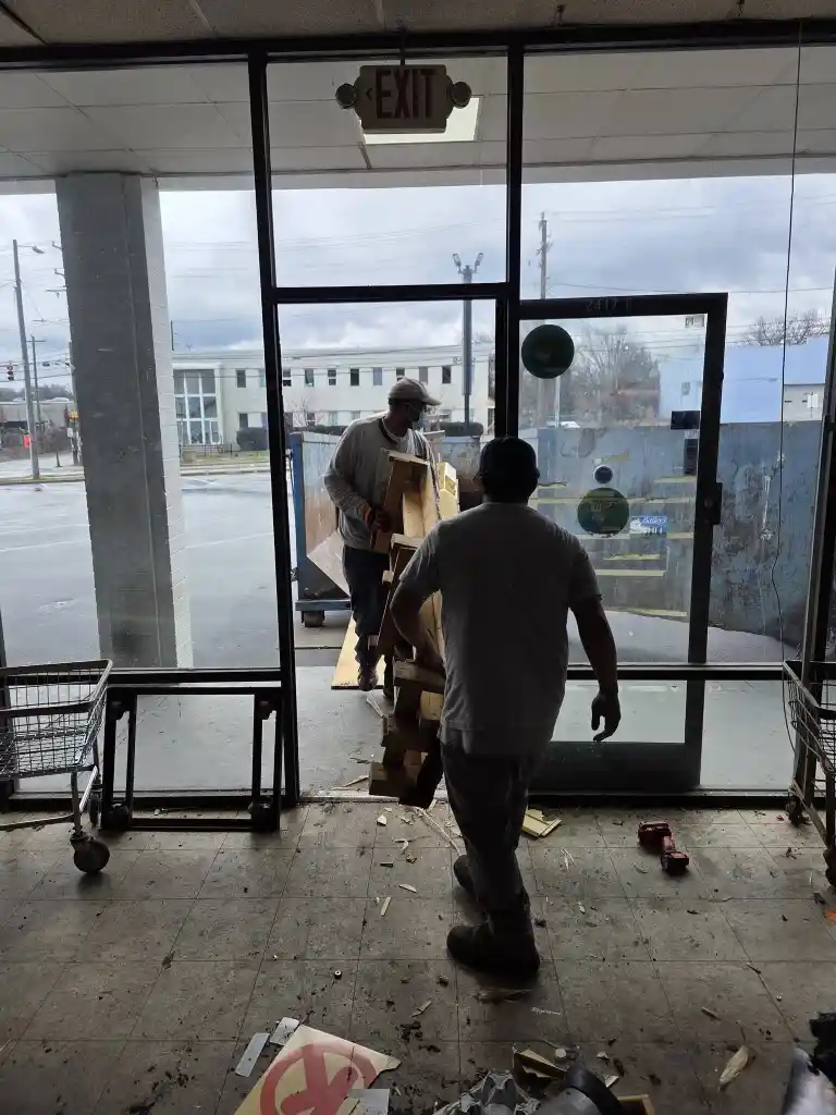 Crew hauling junk out of a building in Lubbock, TX