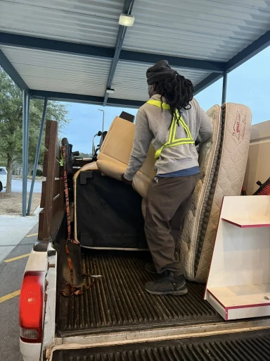 Fastest deposit-protecting move-out clean in Lubbock with furniture and mattress loaded into a pickup truck