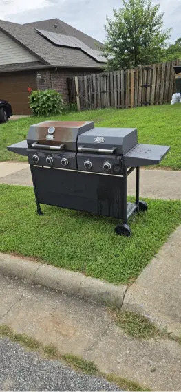 Old grill set at the curb for appliance pickup and haul away in Lubbock