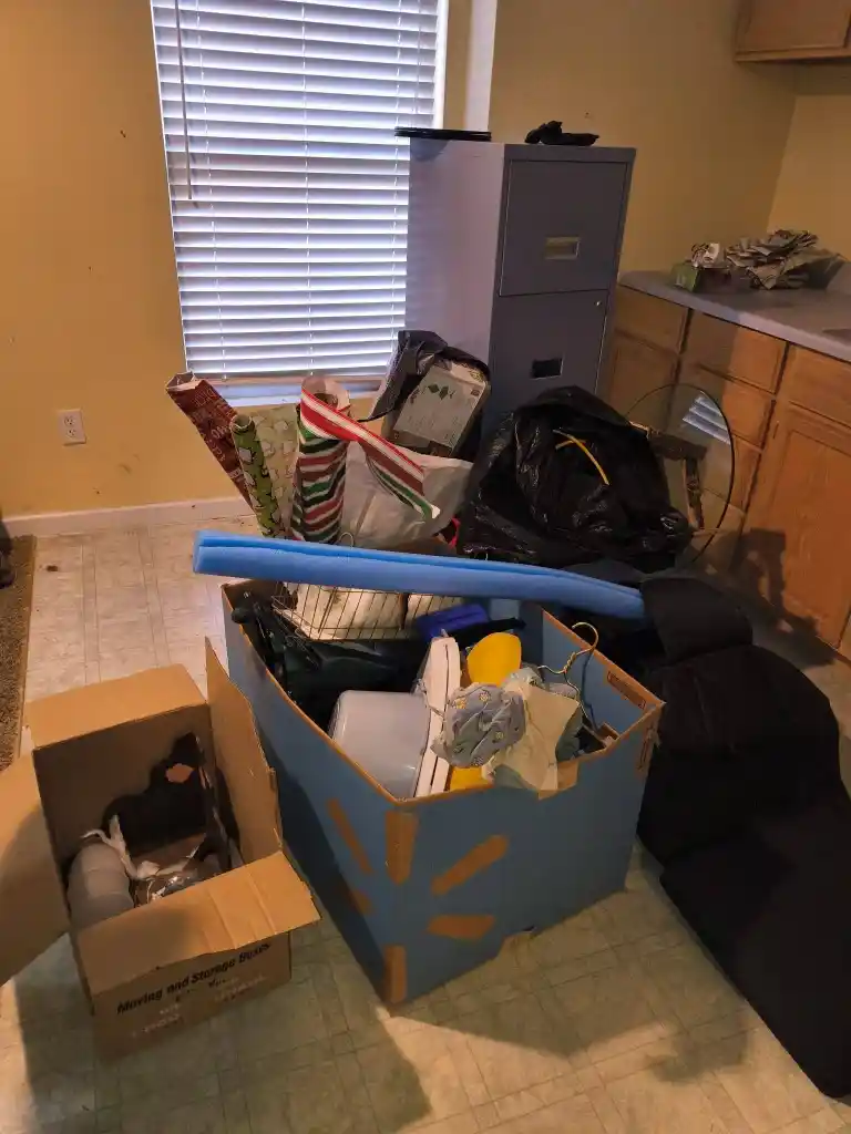 Recycling & Donation Pickup Lubbock with boxes of household items, bags, and small furniture ready to sort